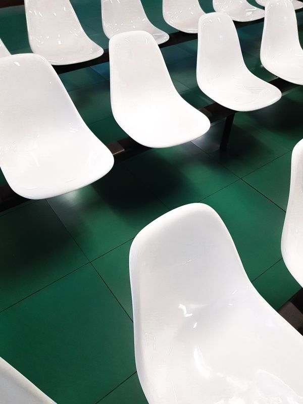 Plastic Products — White Chairs in Rows